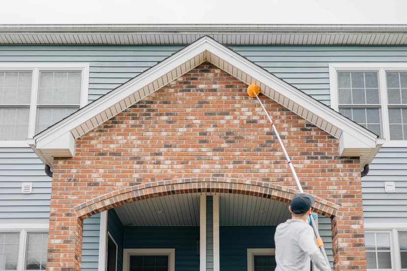 Ruva Pest Control technician performing exterior treatment on home